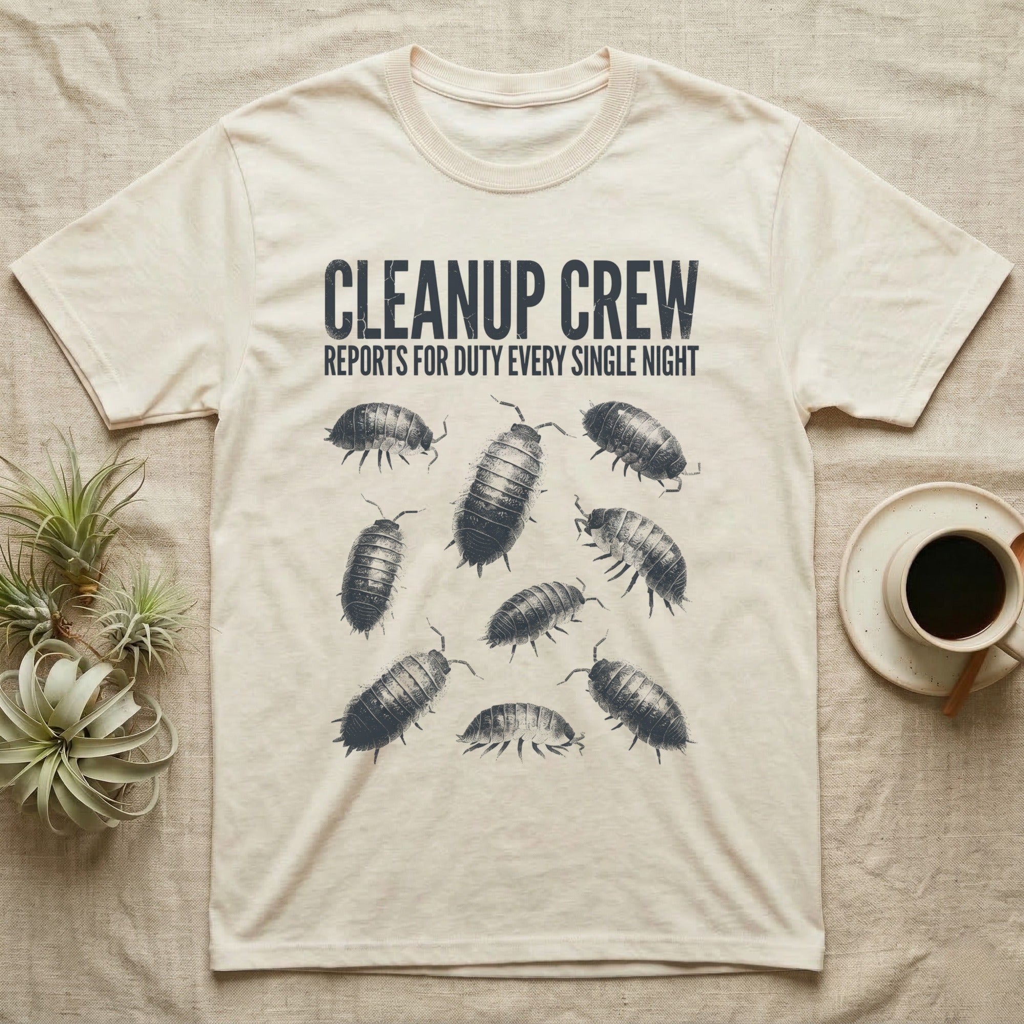 Isopod Cleanup Crew T-Shirt in Natural — One-ink scattered illustration of nine isopods with "Cleanup Crew Reports for Duty" workwear-style lettering.