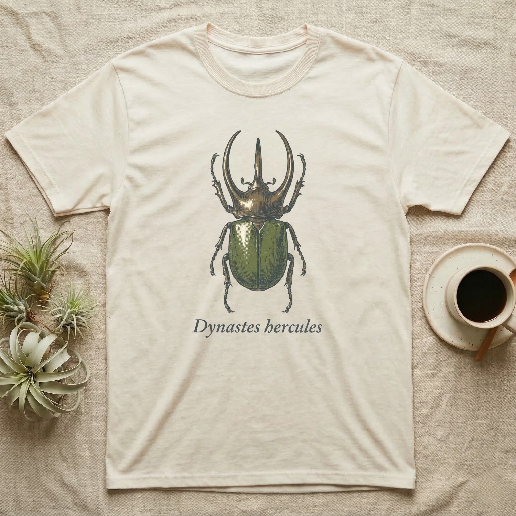 Beige t-shirt with Dynastes Hercules beetle graphic.