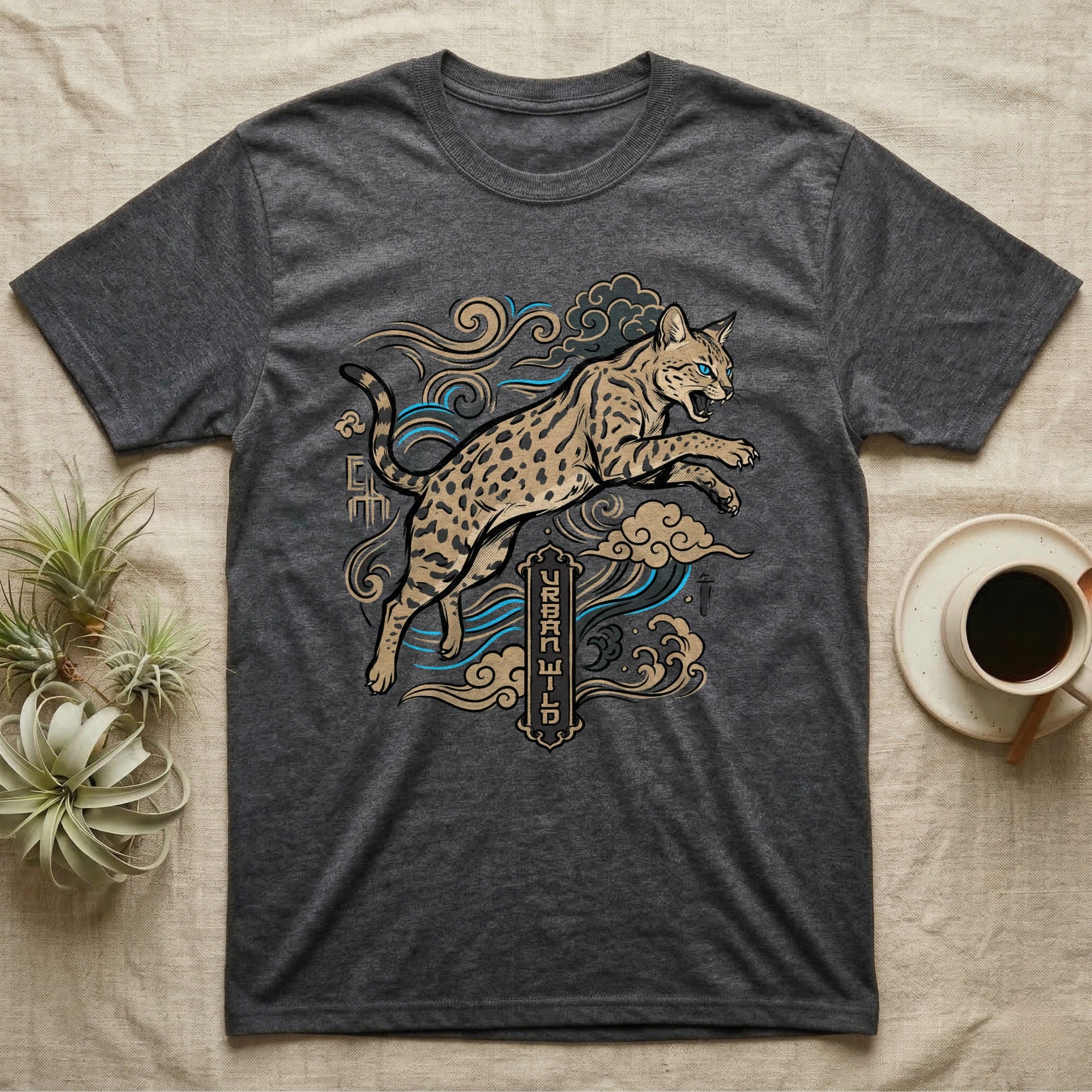 Dark grey t-shirt with a leaping spotted wildcat and blue wave motif.