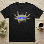 Axolotl Robber Mask T-Shirt in Black — An axolotl's face with a blue marker burglar mask and beanie drawn on the glass.