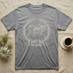 Leopard Gecko Shed T-Shirt in Sport Grey — Leopard gecko mid-shed in a cream brush-ink laurel crest with I DONT PEEL MY GECKO banner on grey