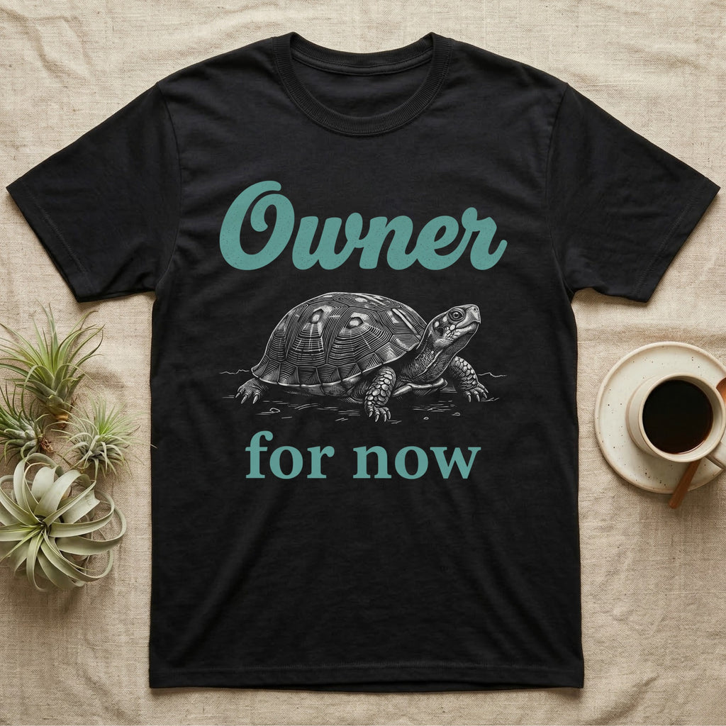 Box Turtle Owner T-Shirt in Black — White engraved eastern box turtle walking forward between the word Owner in teal script and for now in teal serif type.