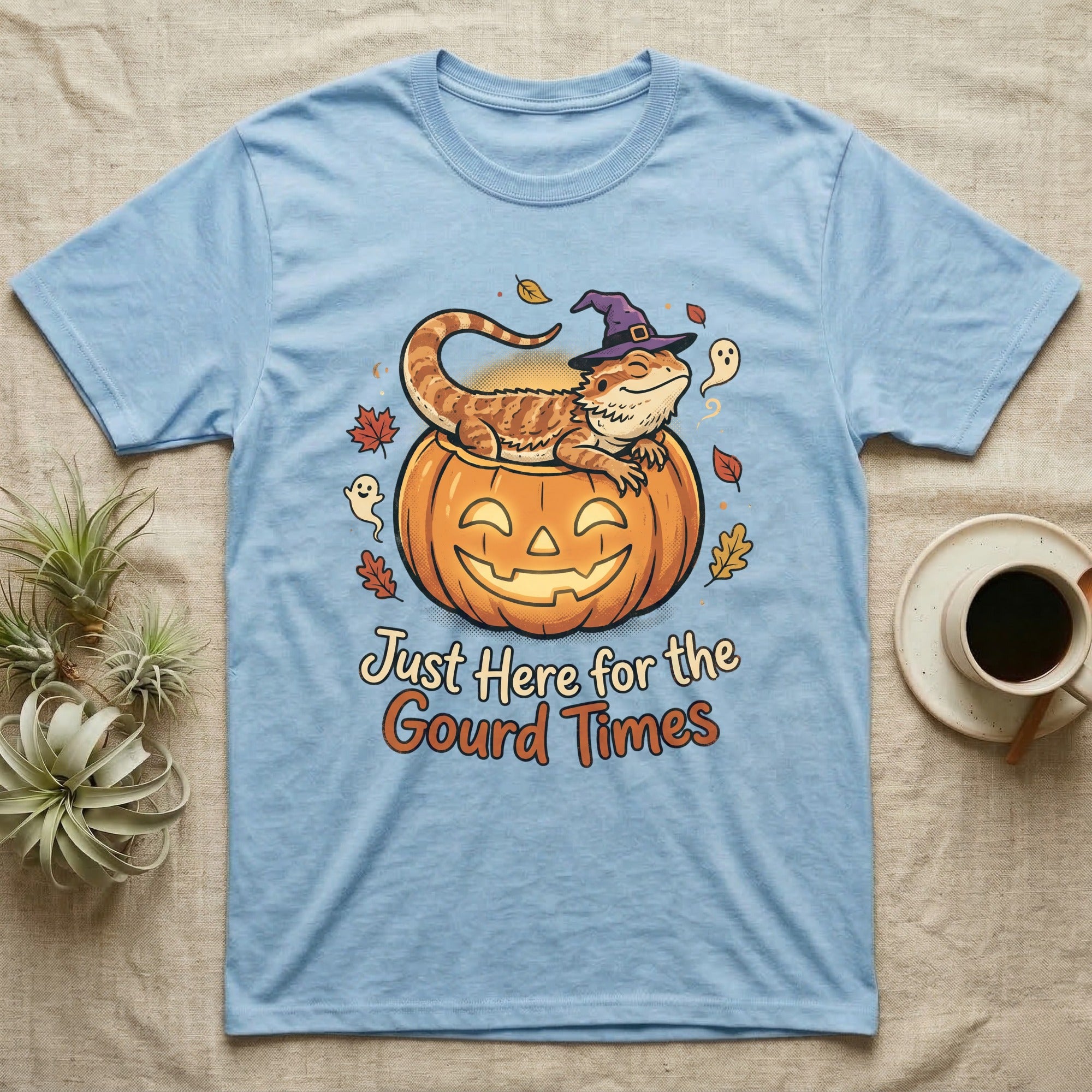Bearded Dragon Gourd Times T-Shirt in Light Blue — Cartoon bearded dragon in a witch hat lounging in a jack-o'-lantern, "Just Here for the Gourd Times."