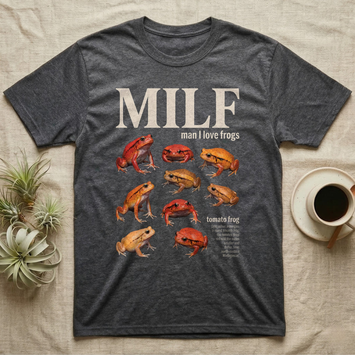 Tomato Frog MILF T-Shirt in Dark Heather — Seven tomato frogs in a cut-out photo collage under the huge cream word MILF, man I love tomato frogs.