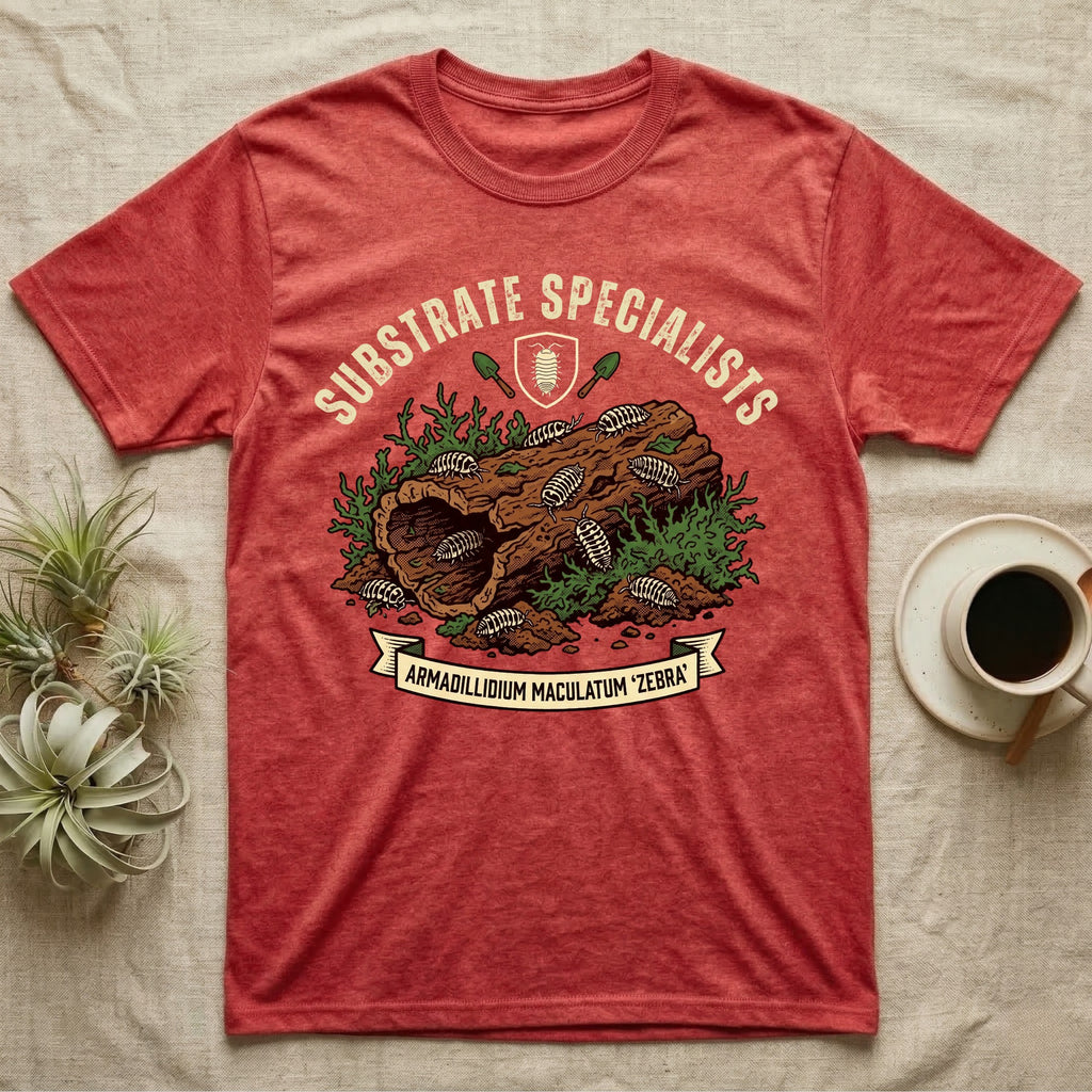 Zebra Isopod Substrate Specialists T-Shirt in Heather Red — Vintage crest of zebra isopods on a mossy cork log with crossed trowels and Armadillidium ribbon.