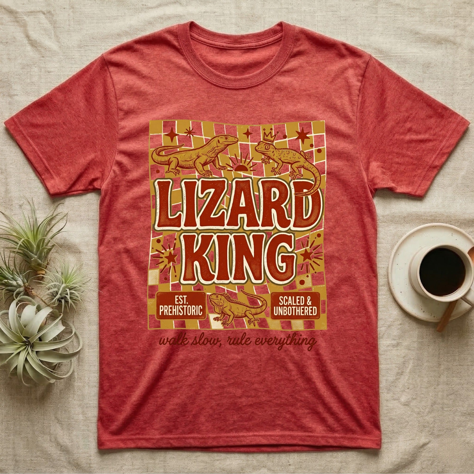 Red t-shirt with "Lizard King" text, prehistoric lizards, and patterned background.