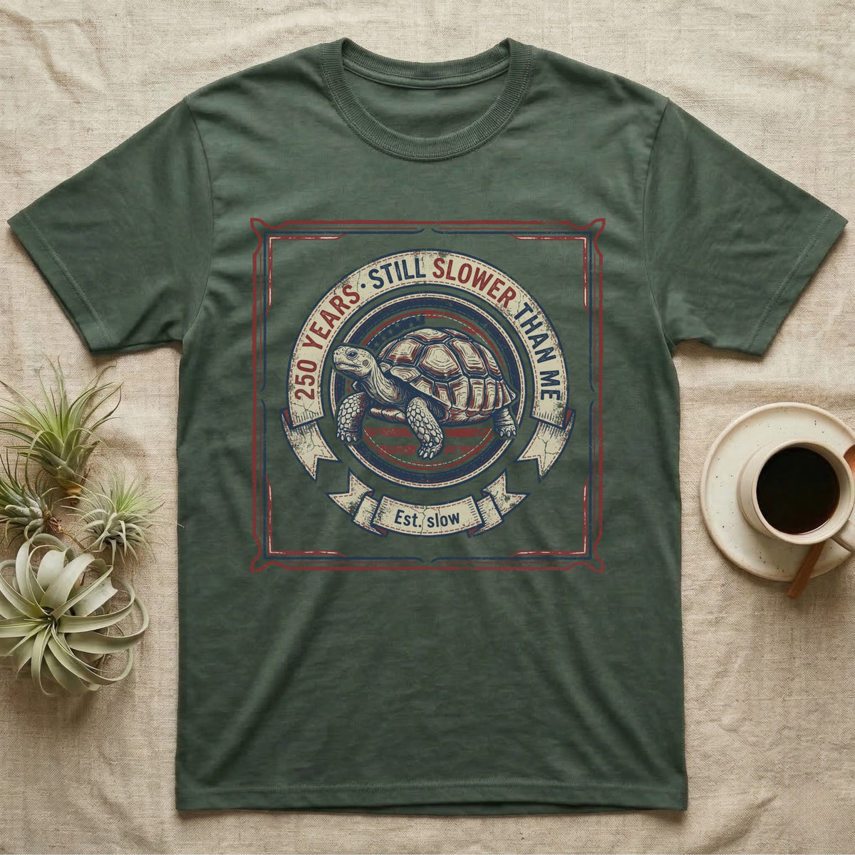 Slower Than Me Tortoise T-Shirt in Military Green — Vintage-Americana roundel illustration of a tortoise with a banner reading "250 Years, Still Slower Than Me."