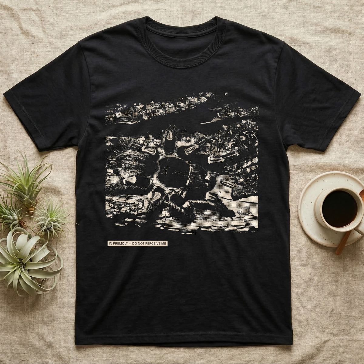 In Premolt Tarantula T-Shirt in Black — Dark macro illustration of a tarantula curled in its hide with a small tag reading "In Premolt, Do Not Perceive Me."