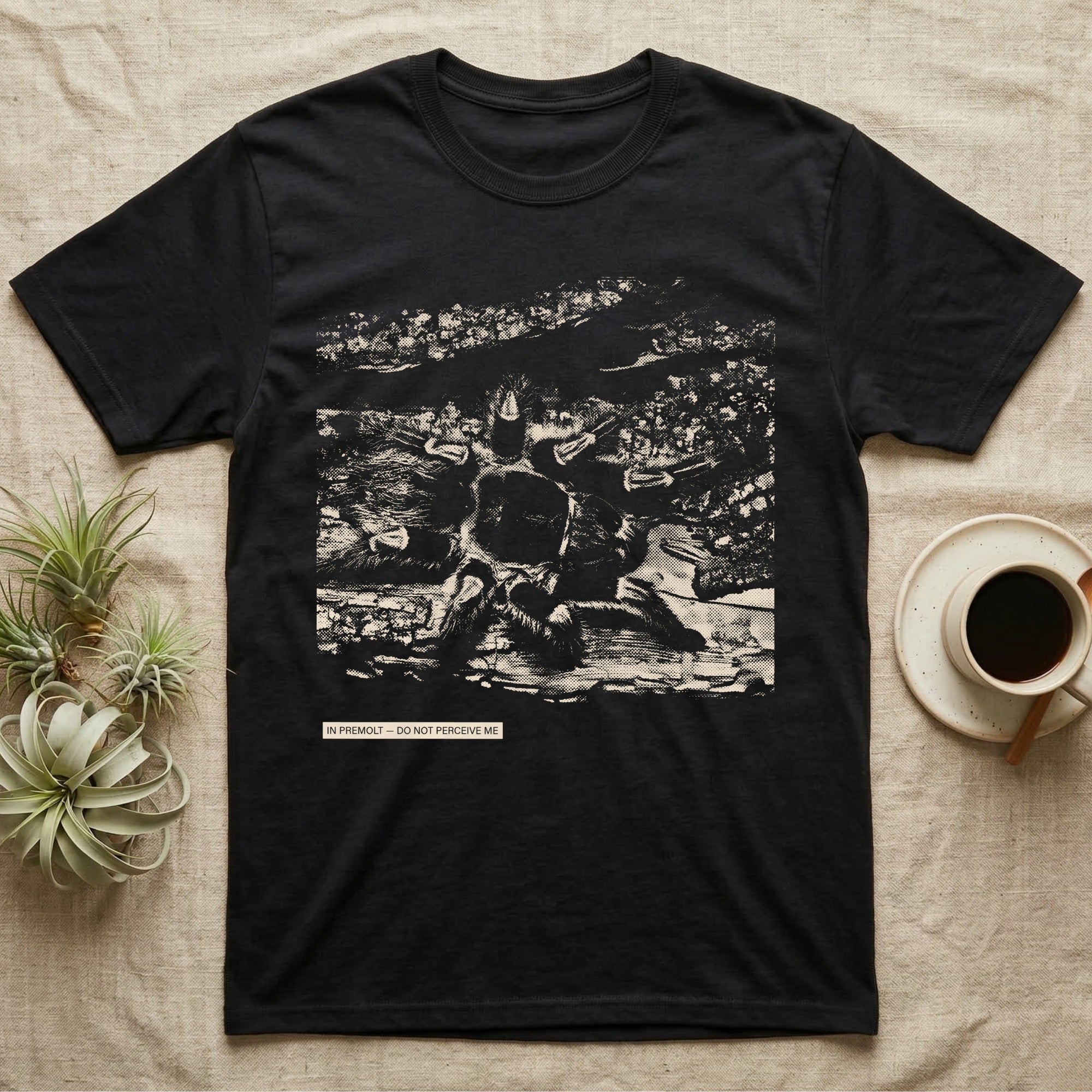 In Premolt Tarantula T-Shirt in Black — Dark macro illustration of a tarantula curled in its hide with a small tag reading "In Premolt, Do Not Perceive Me."