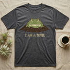 Dark grey t-shirt with a frog emerging from dirt, text reads "I AM A ROCK."
