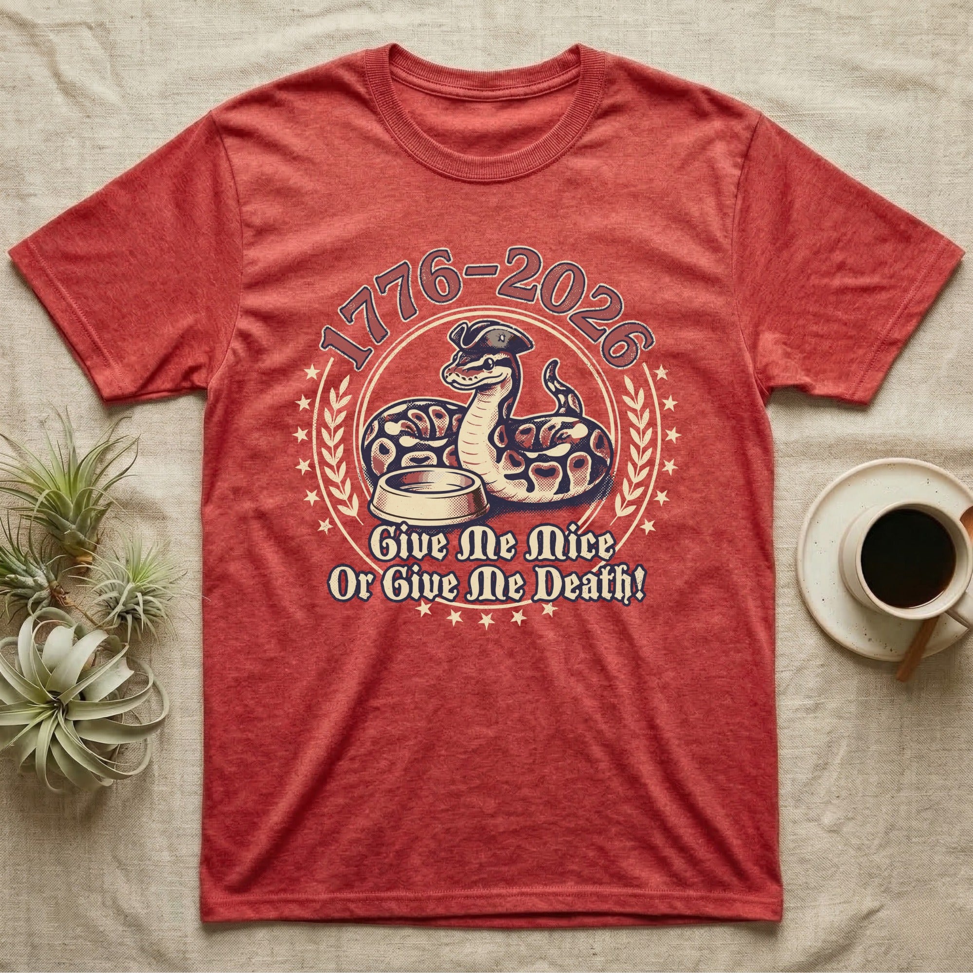 Ball Python 1776 T-Shirt in Heather Red — Vintage distressed badge of a ball python in a feeding strike over a food dish, cream and brick-red emblem reading Give Me Mice Or Give Me Death.
