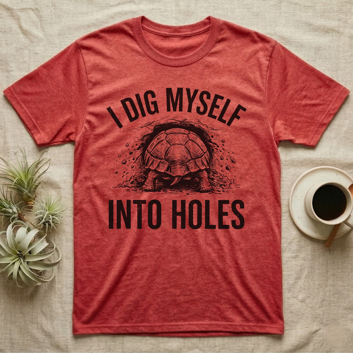 Russian Tortoise Digging T-Shirt in Heather Red — Etched Russian tortoise digging headfirst into an earth bank, only its back end out, with the words I Dig Myself Into Holes