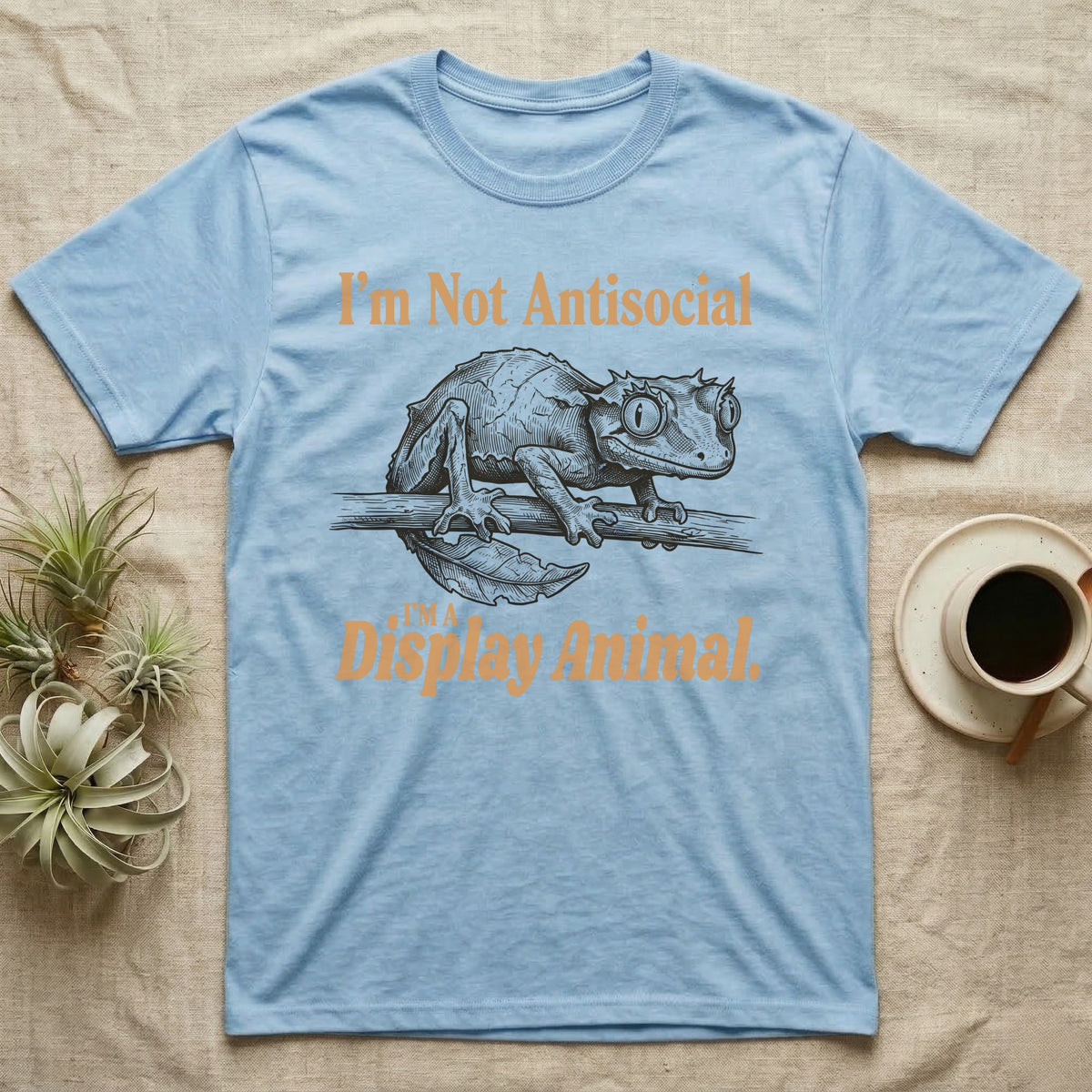 Leaf-Tailed Gecko Display T-Shirt in Light Blue — Engraved satanic leaf-tailed gecko on a branch staring out, with the words I'm Not Antisocial, I'm a Display Animal