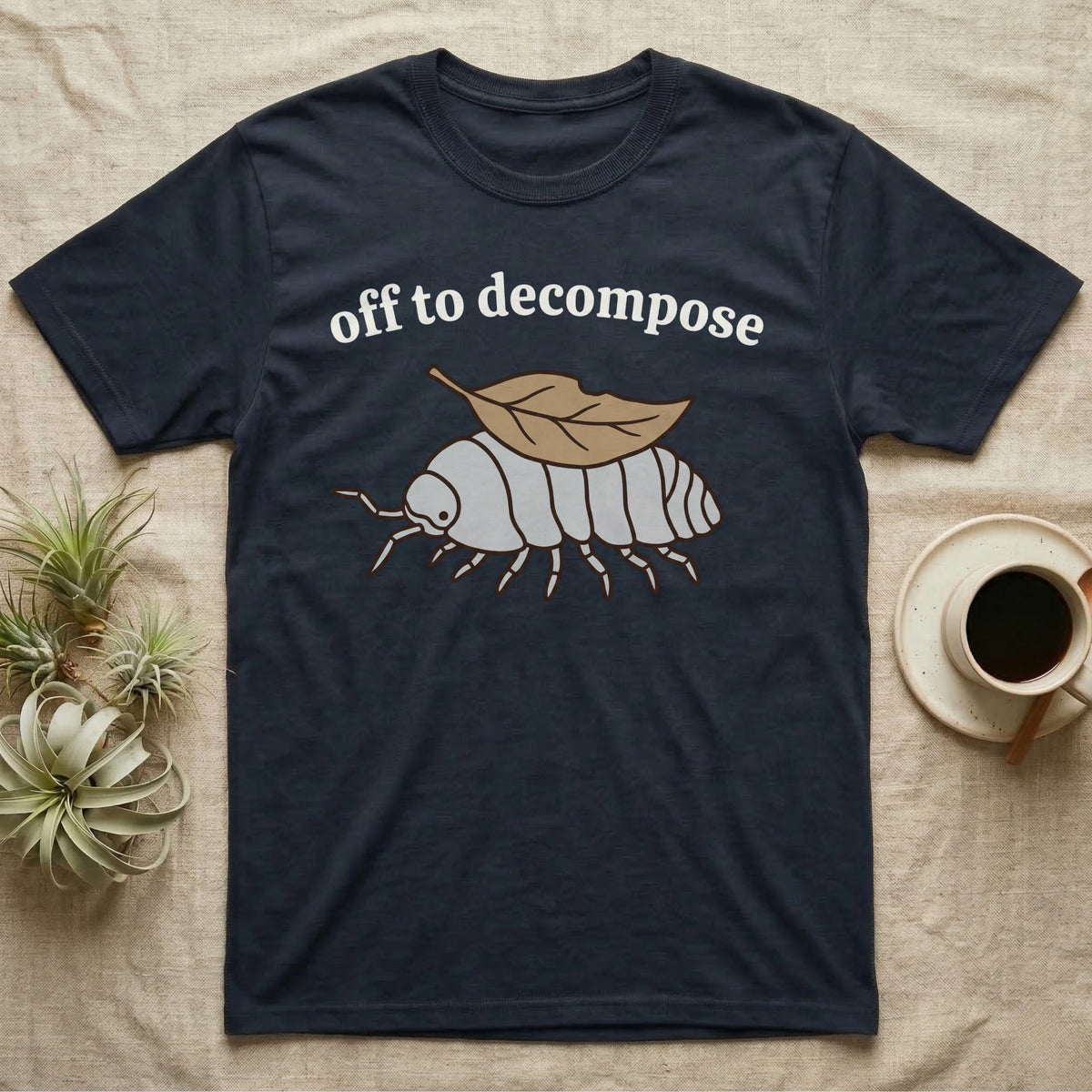 Isopod Decomposer T-Shirt in Navy — Minimal doodle of a grey isopod walking off with a dead leaf on its back under the words off to decompose