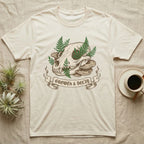 Cream t-shirt with skull, mushrooms, ferns, and "Growth & Decay" ribbon.