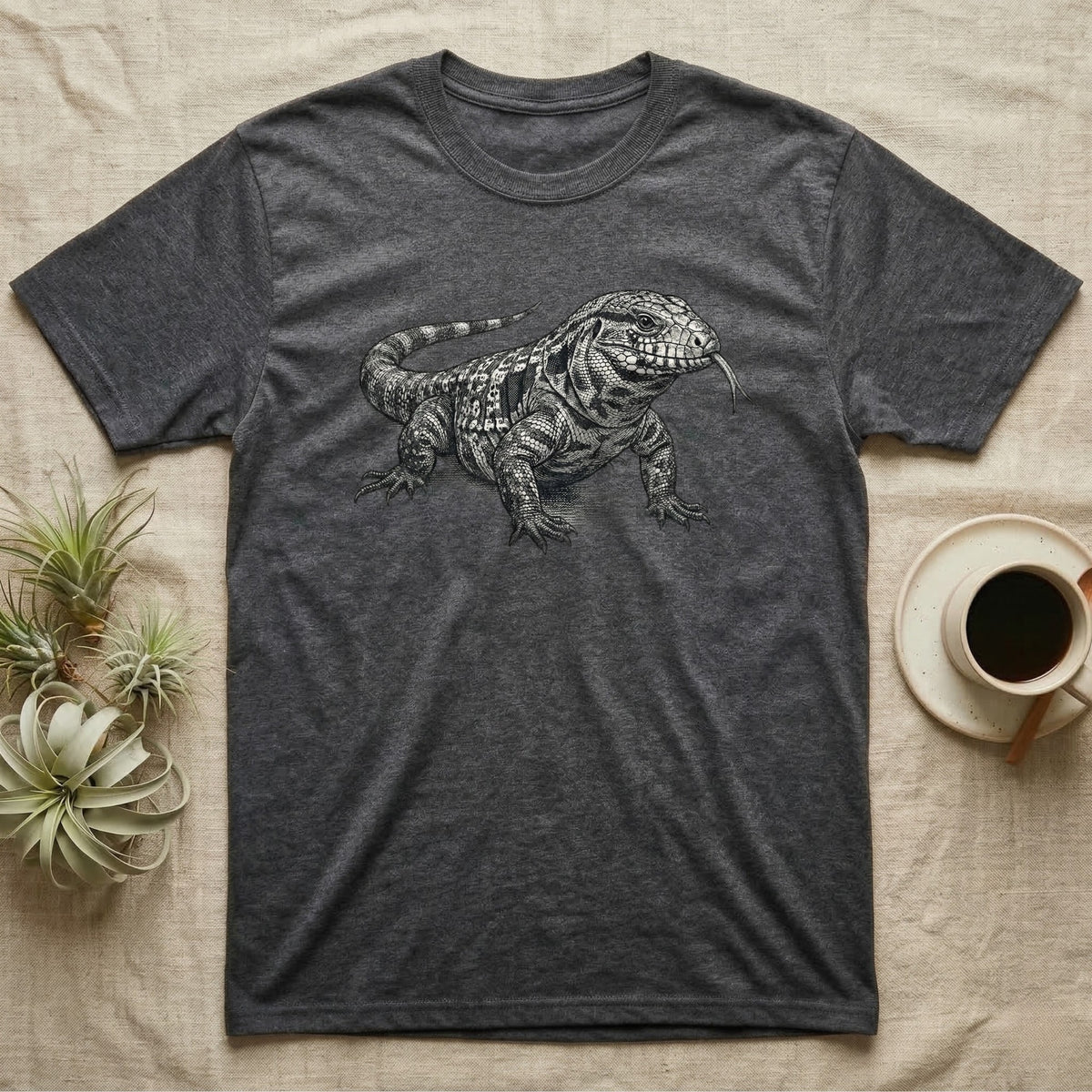 Dark gray t-shirt with a black and white drawing of a tegu lizard.