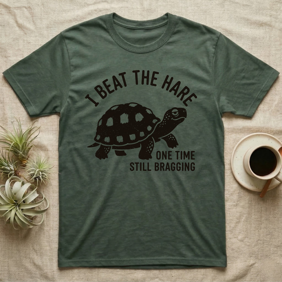 Red-Foot Tortoise Bragging T-Shirt in Military Green — Smug red-footed tortoise walking chin-up under I Beat the Hare, One Time, Still Bragging