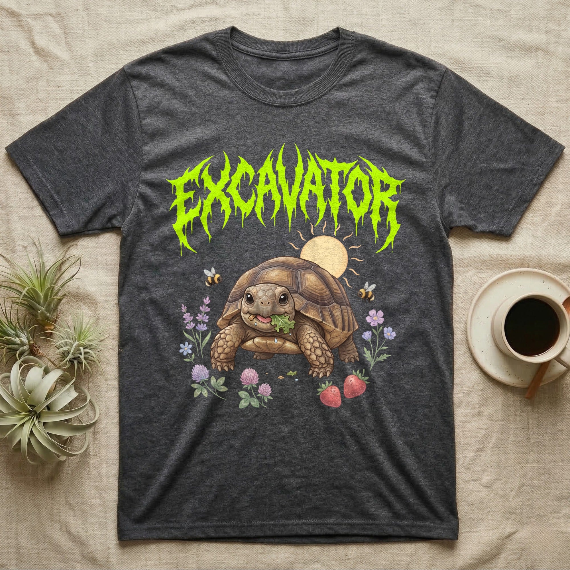 Russian Tortoise Feral T-Shirt in Dark Heather — Chubby Russian tortoise munching a green in a pastel meadow under a spiky lime metal wordmark reading EXCAVATOR.