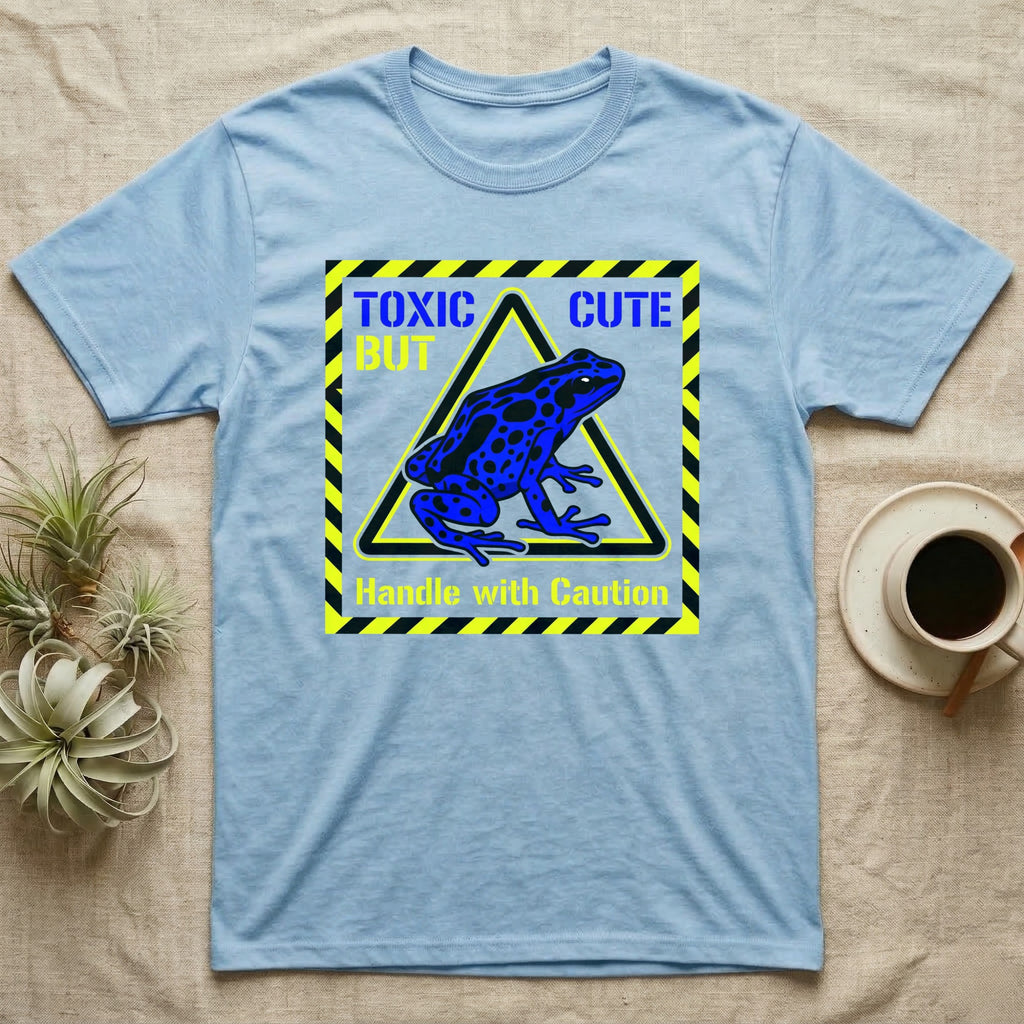 Blue t-shirt with black and yellow "TOXIC CUTE" warning sign and blue frog graphic.