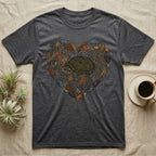Grey t-shirt with a heart-shaped design of a turtle, leaves, and stones.