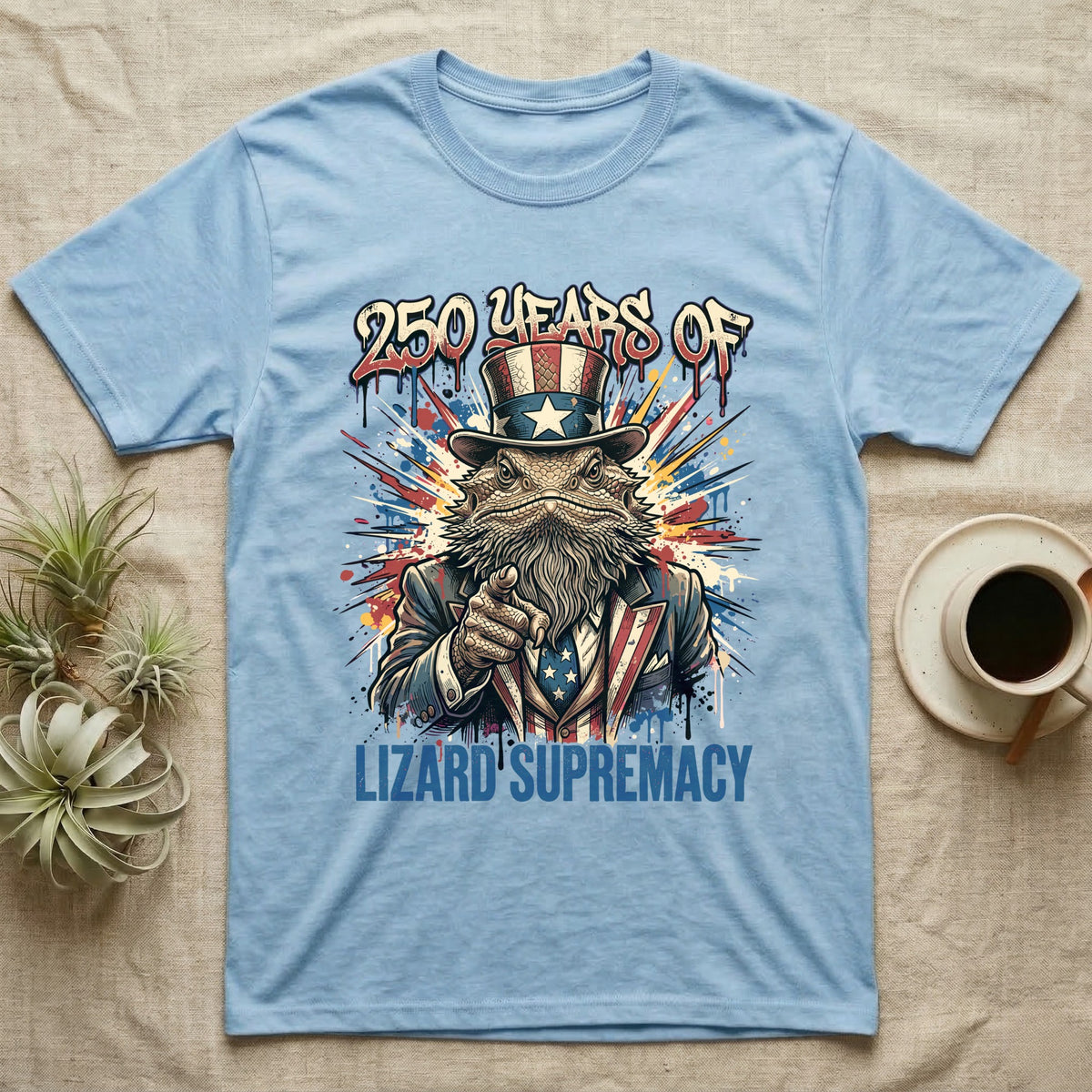 Bearded Dragon Uncle Sam T-Shirt in Light Blue — Splatter-art bearded dragon as Uncle Sam pointing forward under text 250 Years of Lizard Supremacy.