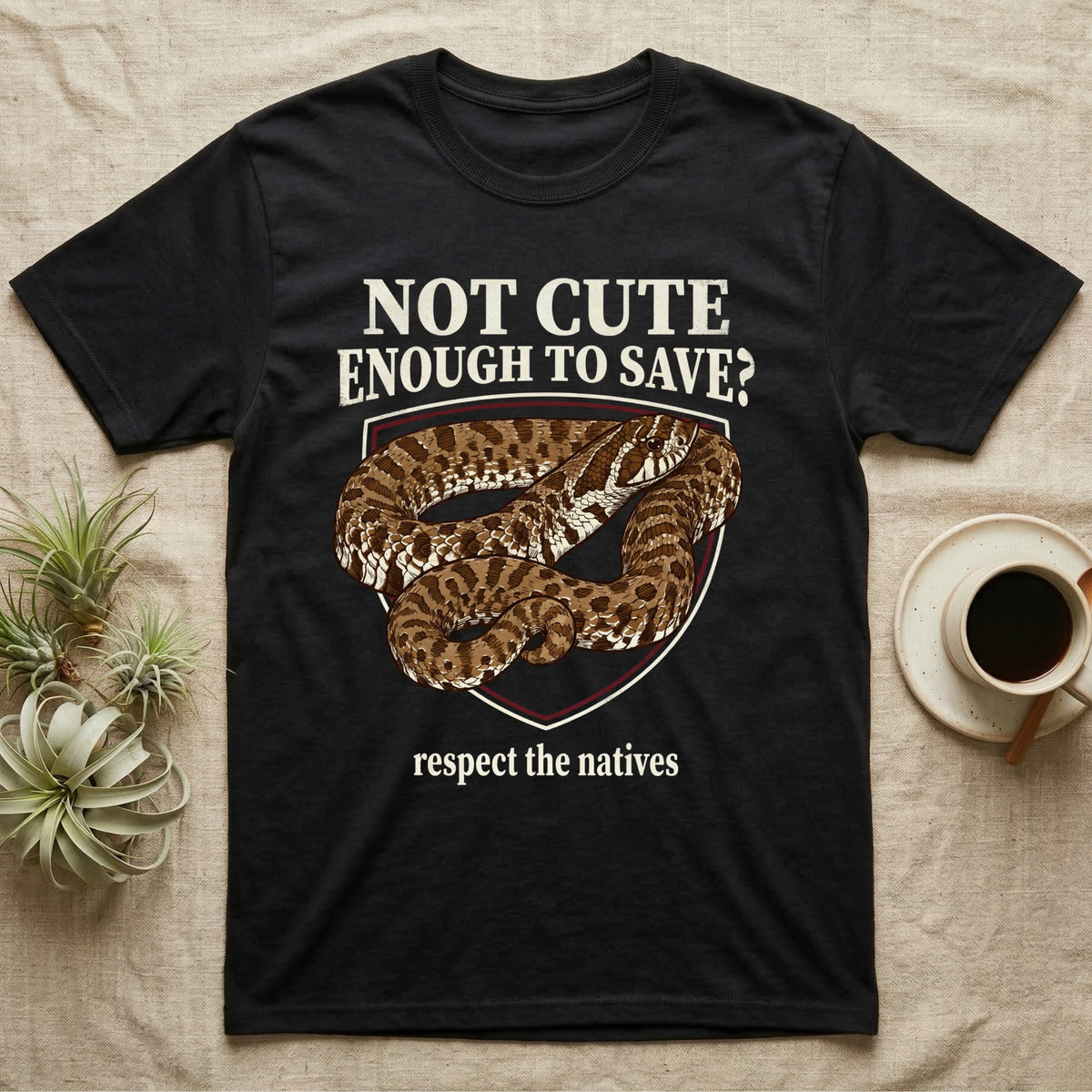 Hognose Snake Conservation T-Shirt in Black — Vintage-poster illustration of a western hognose snake portrait in a sepia crest with conservation banner text.