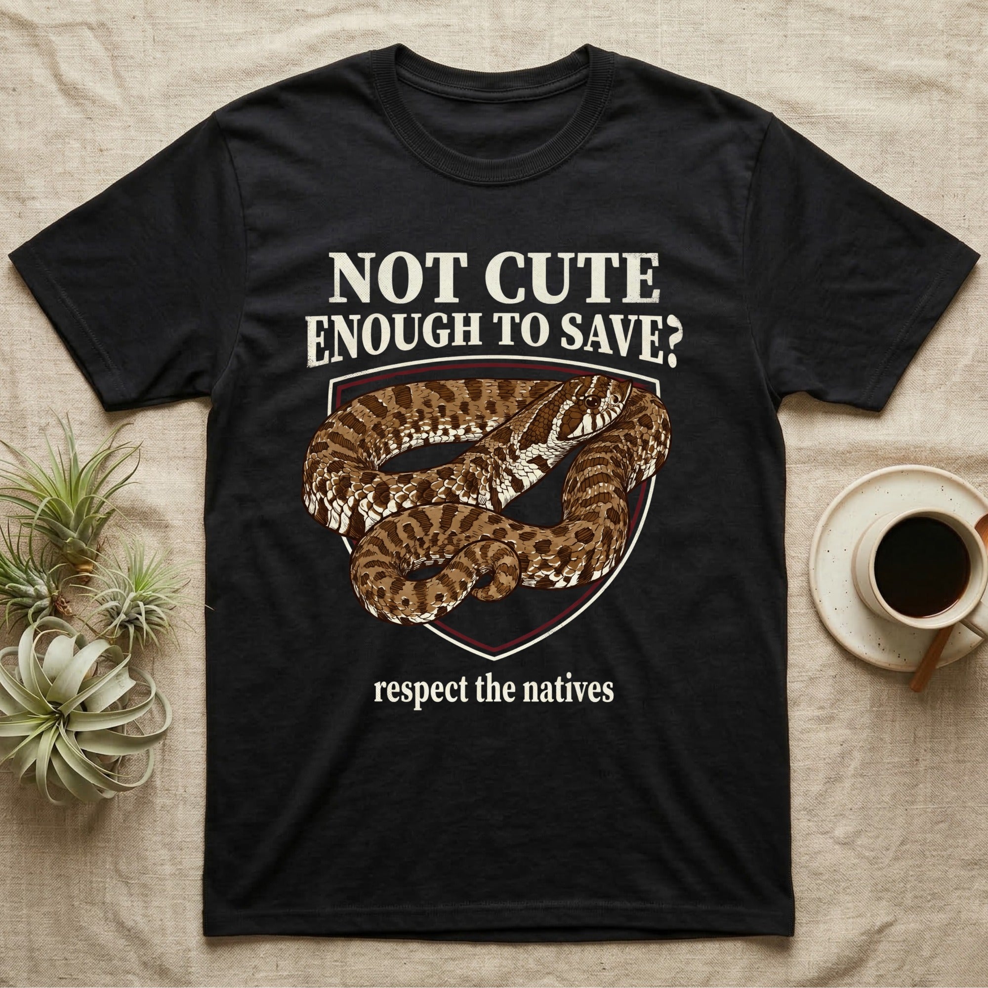 Hognose Snake Conservation T-Shirt in Black — Vintage-poster illustration of a western hognose snake portrait in a sepia crest with conservation banner text.