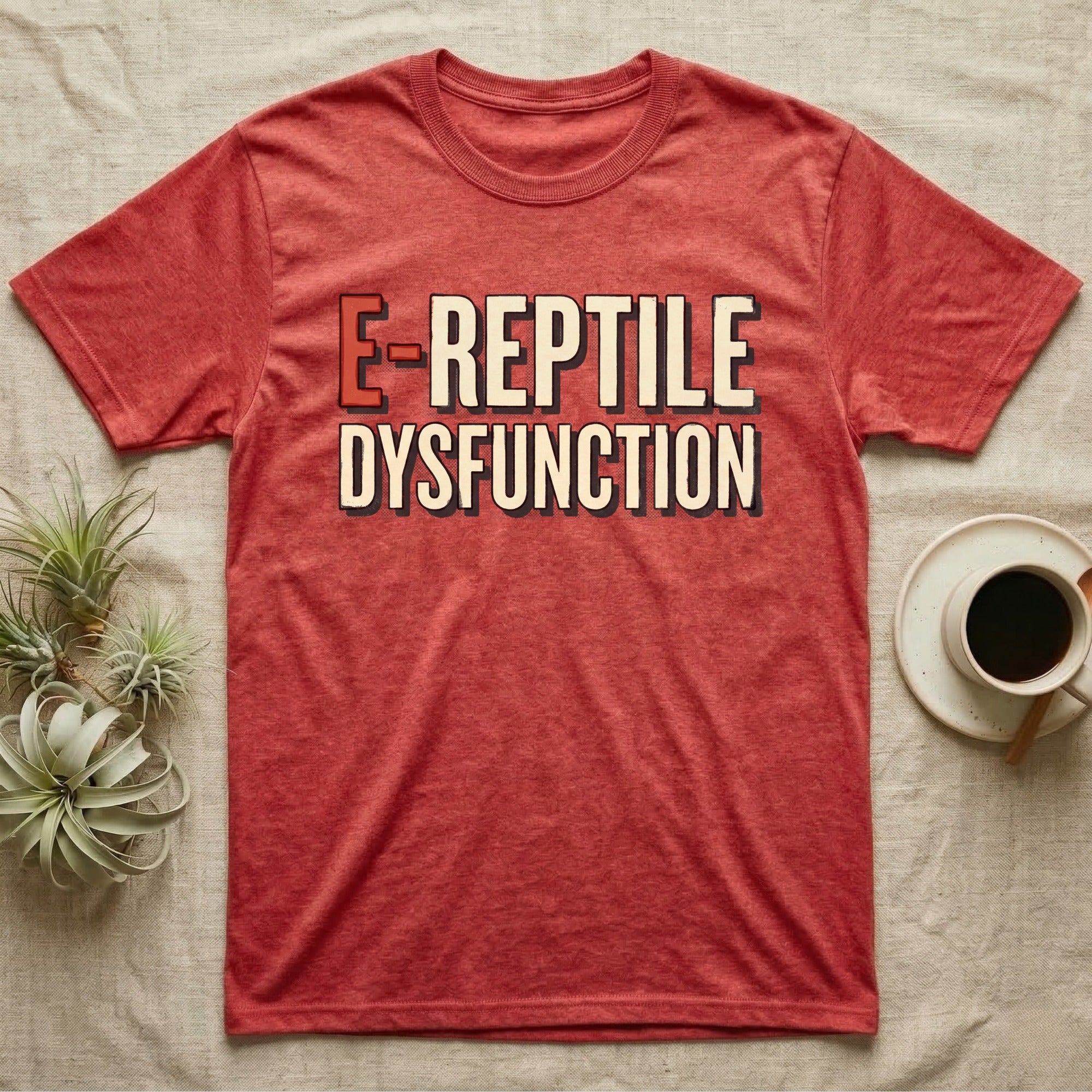 E-Reptile Dysfunction Gecko T-Shirt in Heather Red — Retro-pharmacy typographic wordmark reading "E-Reptile Dysfunction" in distressed cream and tomato-red lettering.