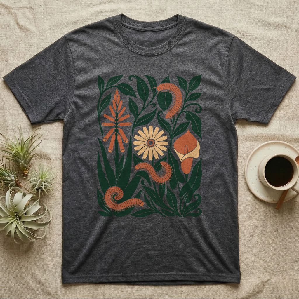 African Millipede Botanical T-Shirt in Dark Heather — Flat cut-paper botanical panel in navy, brick red and blush with three giant African millipedes coiled among the leaves.