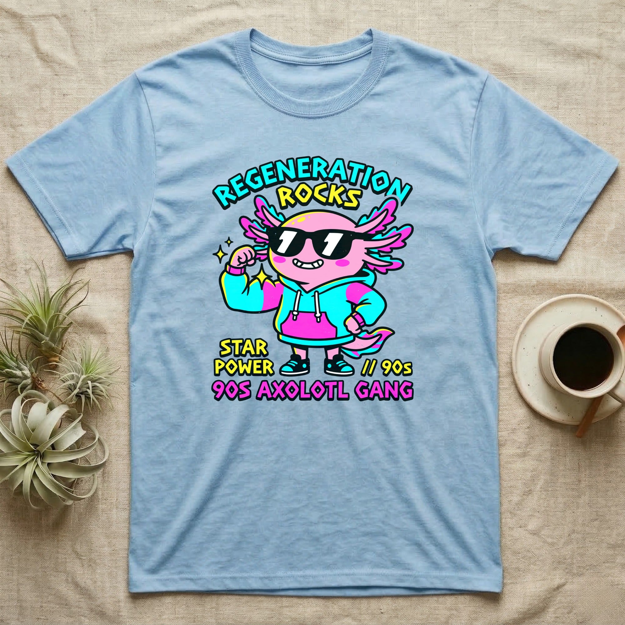 Axolotl Regeneration Rocks T-Shirt in Light Blue — Neon 90s cartoon pink axolotl in shades flexing under "Regeneration Rocks" lettering.