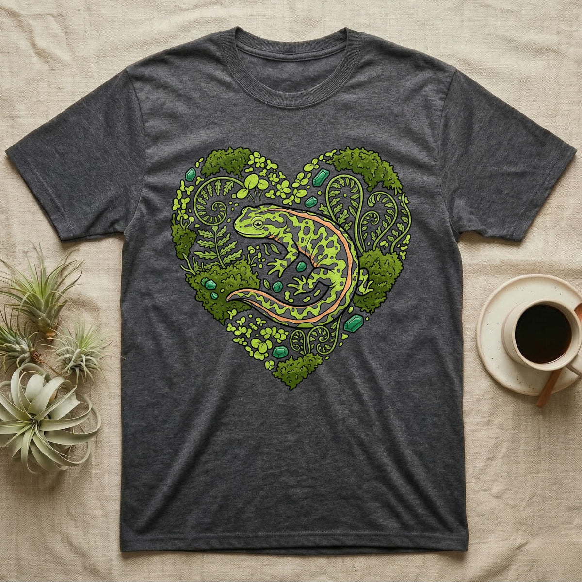 Dark grey t-shirt with a heart-shaped design of a salamander and ferns.