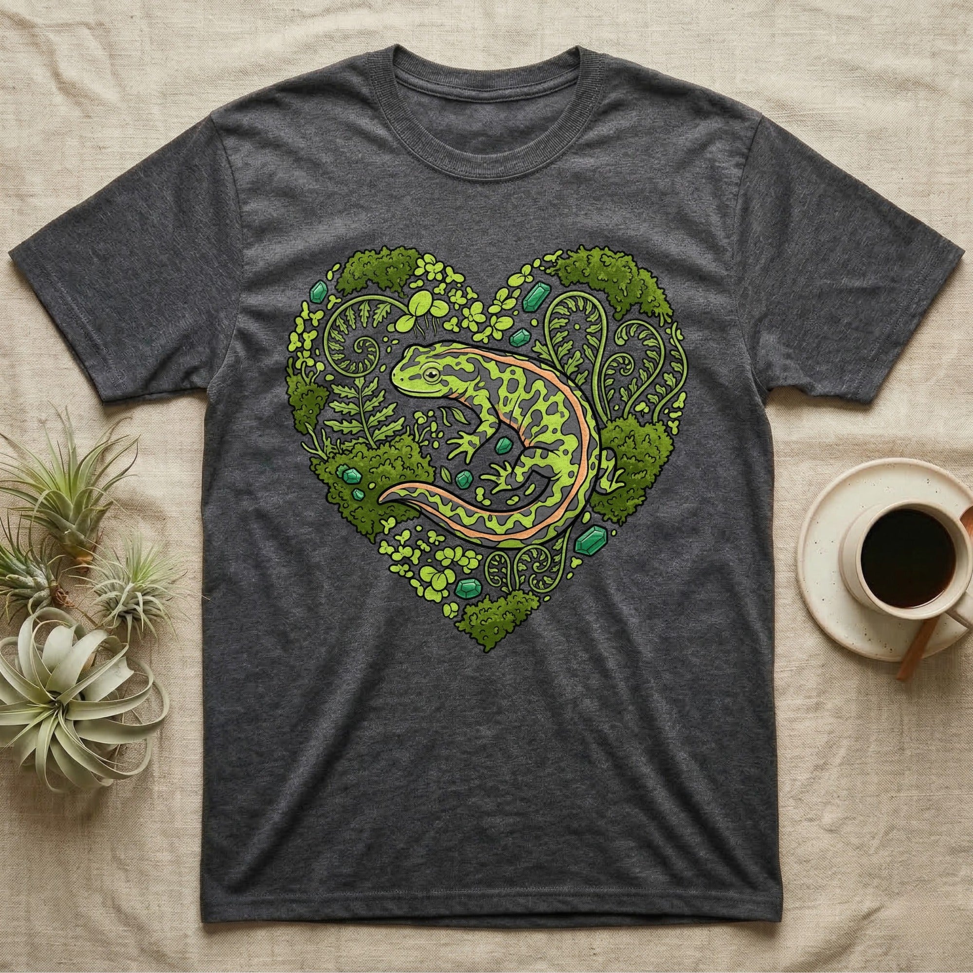 Dark grey t-shirt with a heart-shaped design of a salamander and ferns.