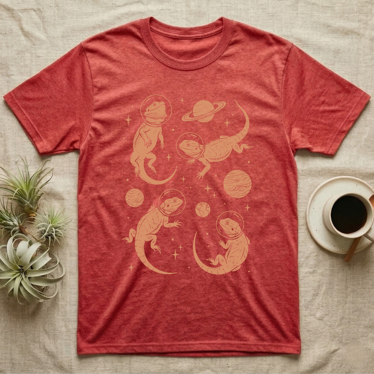 Bearded Dragon Cosmic T-Shirt in Heather Red — Vintage screen-print illustration of bearded dragons in astronaut helmets floating in space, warm copper monochromatic on dark background.