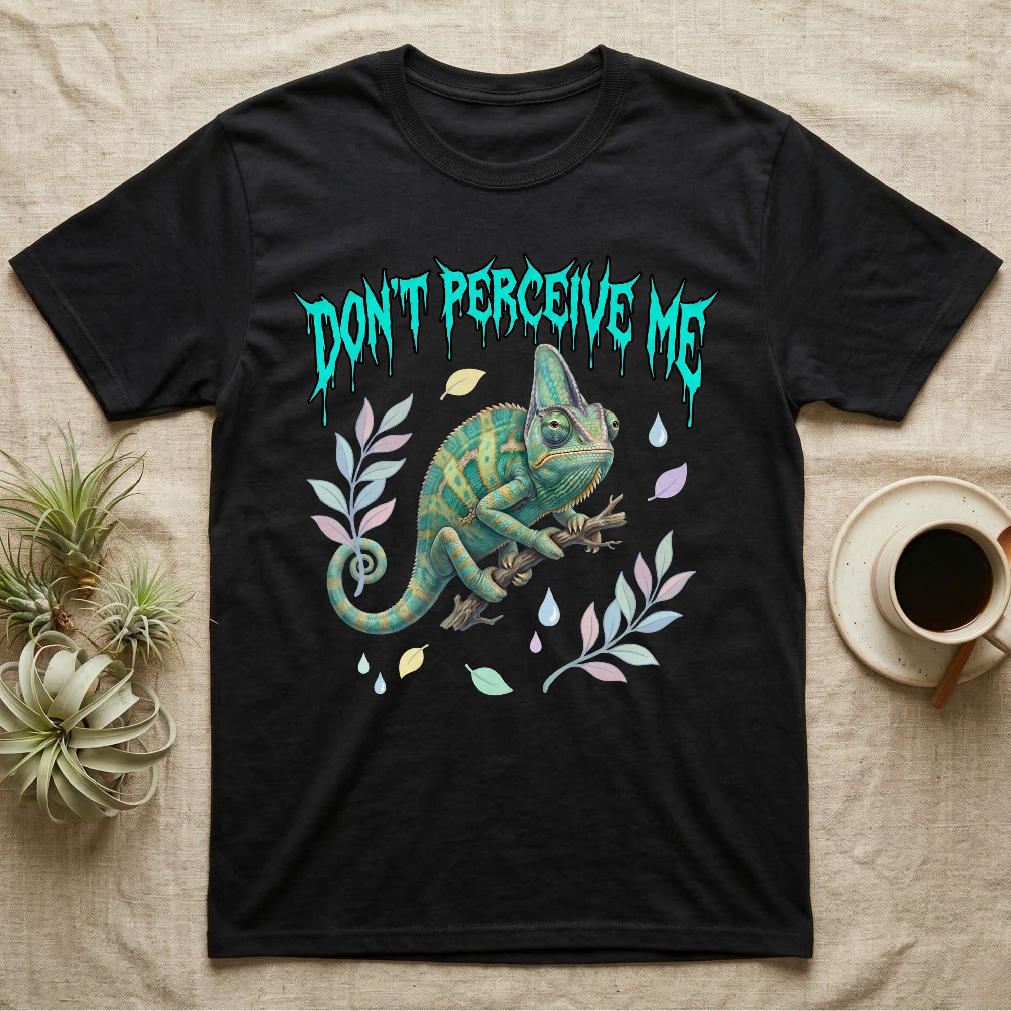 Veiled Chameleon Feral T-Shirt in Black — Veiled chameleon on a branch with swivelling eyes under a jagged turquoise metal "DON'T PERCEIVE ME" wordmark.