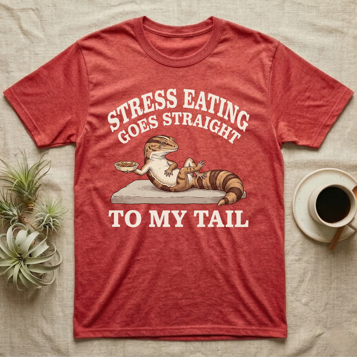 Fat-Tailed Gecko Snacking T-Shirt in Heather Red — Engraved fat-tailed gecko lounging on a stone with mealworms under Stress Eating Goes Straight To My Tail