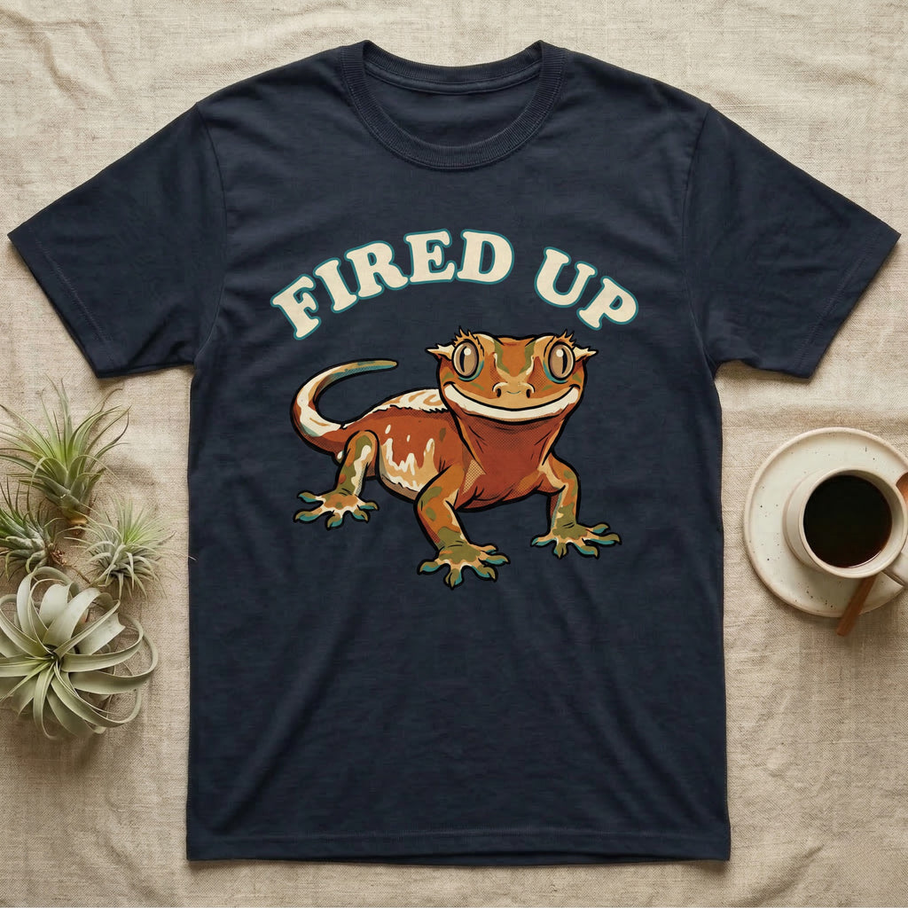 Fired Up Crested Gecko T-Shirt in Navy — Retro 90s-style illustration of a fired-up crested gecko under a bold arc headline reading Fired Up.