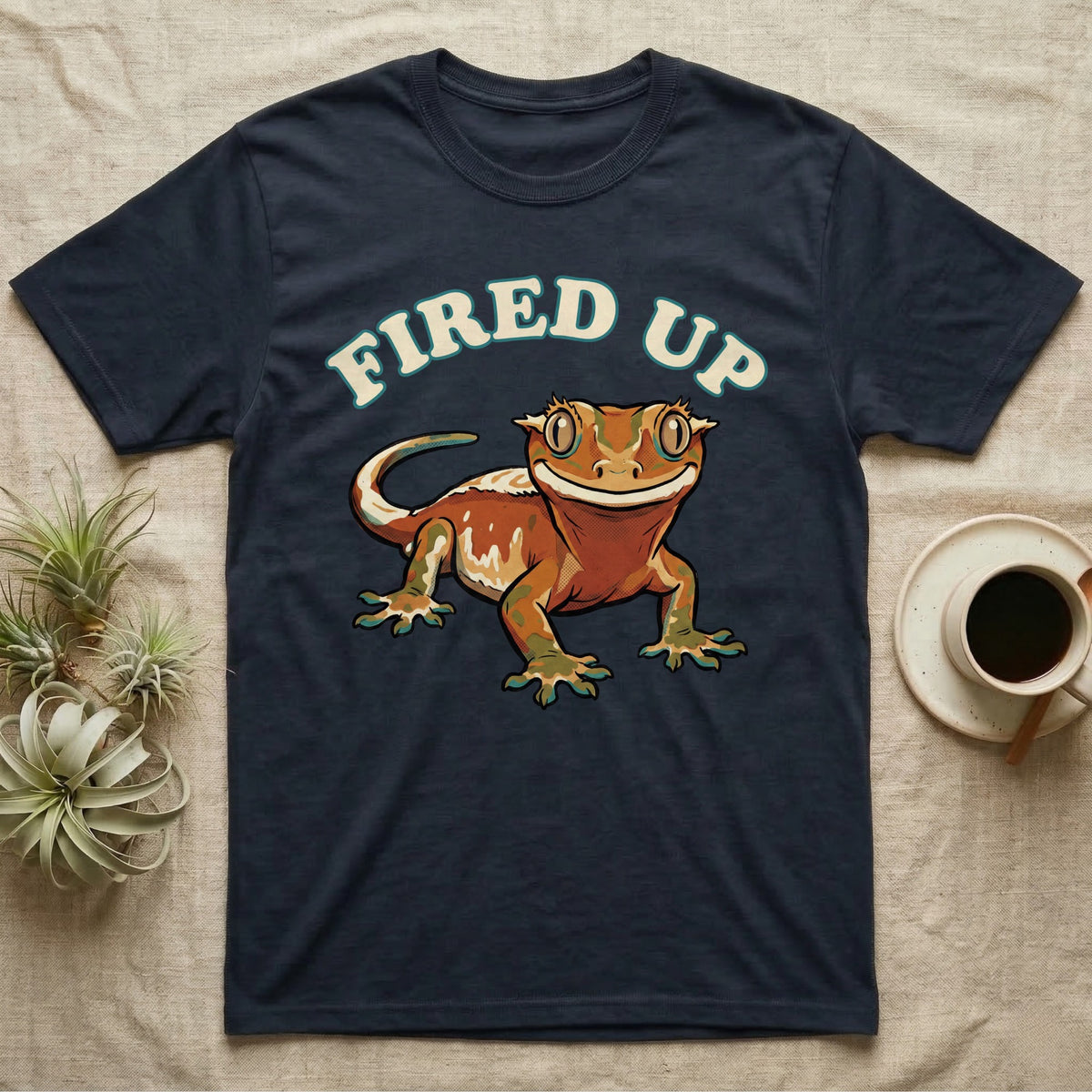 Fired Up Crested Gecko T-Shirt in Navy — Retro 90s-style illustration of a fired-up crested gecko under a bold arc headline reading Fired Up.