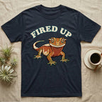 Fired Up Crested Gecko T-Shirt in Navy — Retro 90s-style illustration of a fired-up crested gecko under a bold arc headline reading Fired Up.