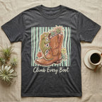 Dark grey t-shirt with green gecko climbing a cowboy boot with flowers.