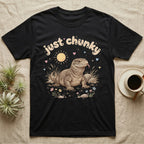 Savannah Monitor Softie T-Shirt in Black — Plump savannah monitor lizard with flicking tongue under pastel bubble text "just chunky" and hearts.