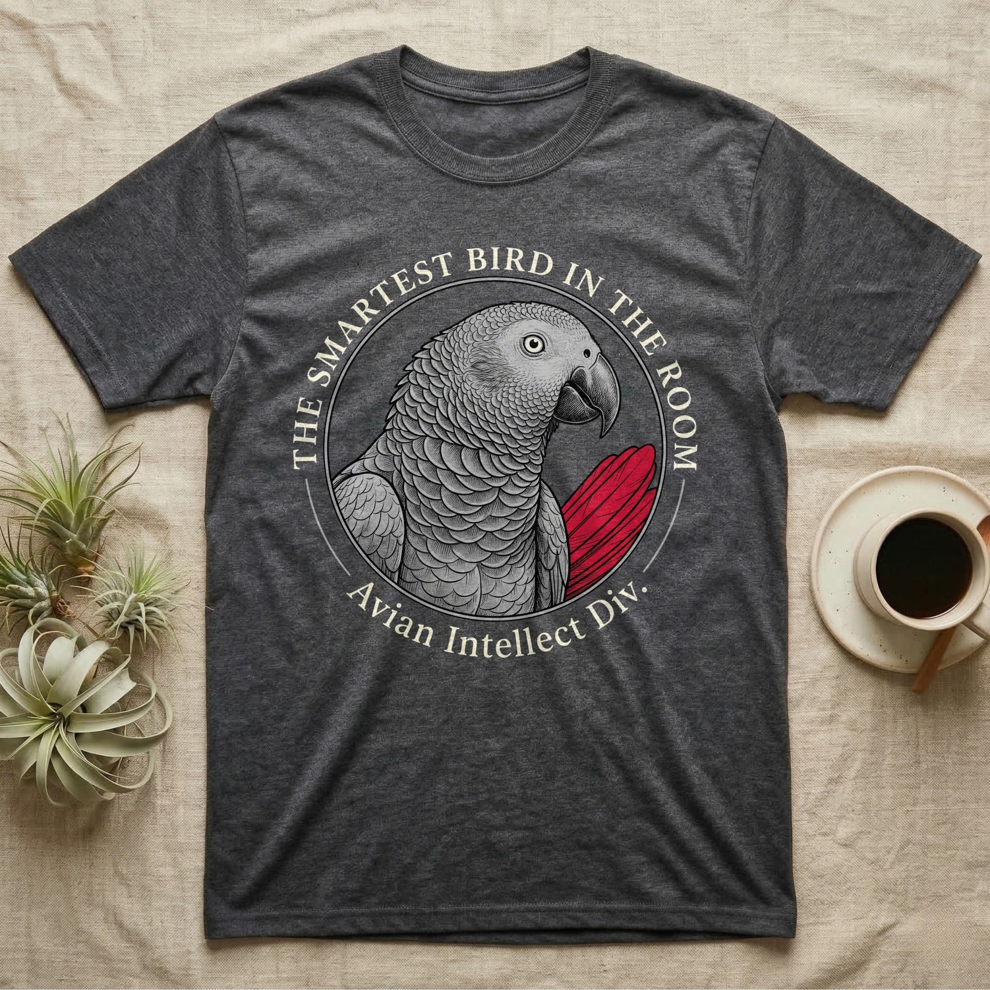Grey parrot on charcoal t-shirt with text "The Smartest Bird in the Room".