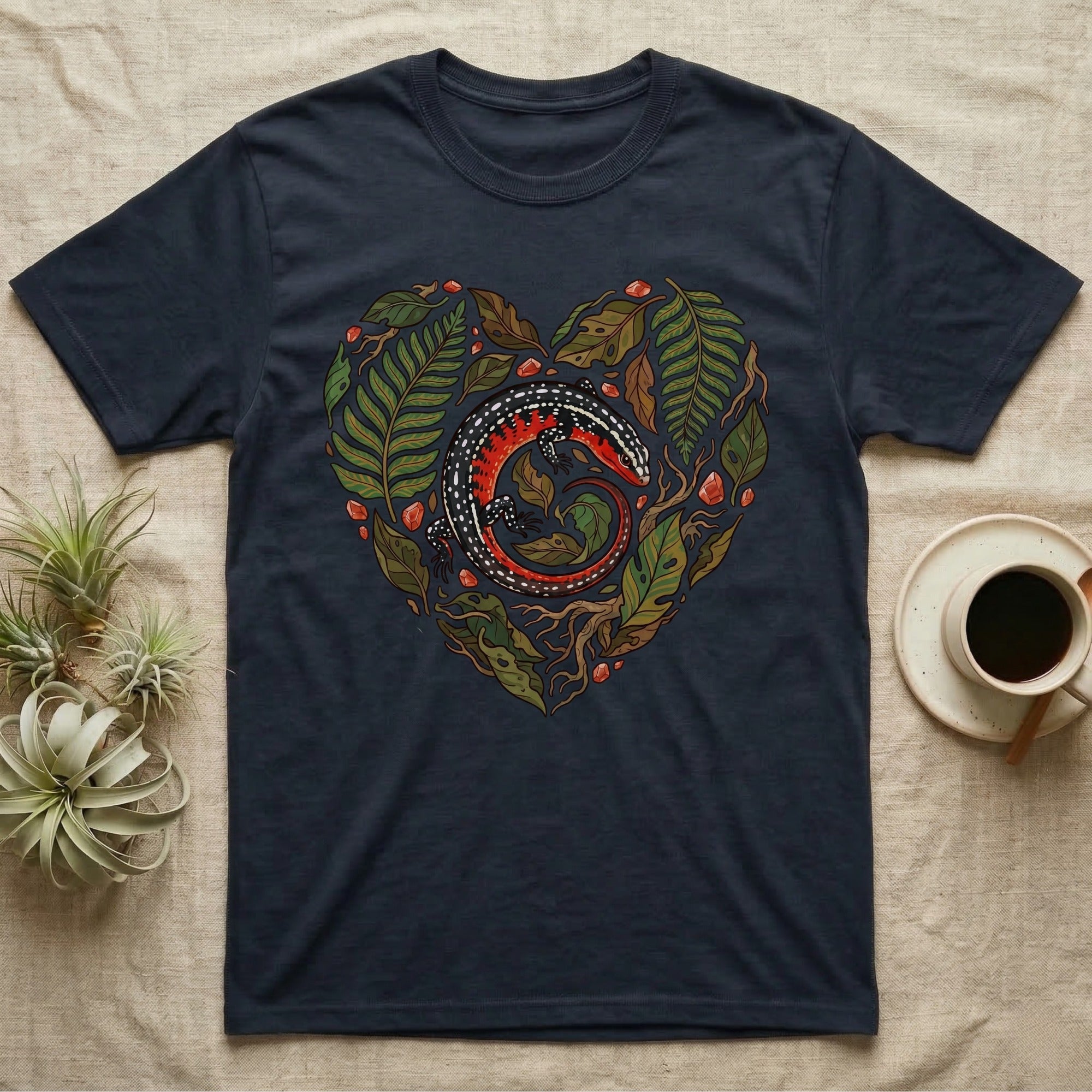 Navy t-shirt with a heart-shaped design of a lizard and foliage.