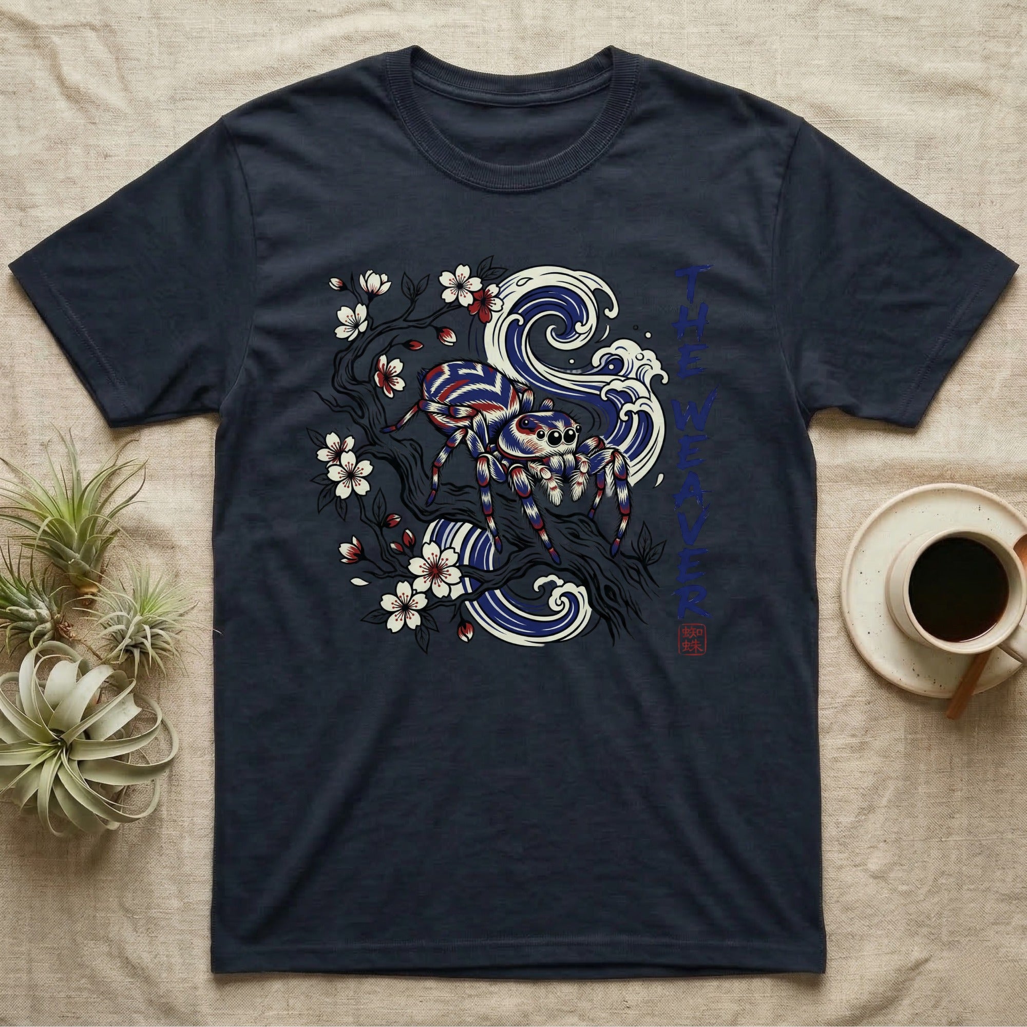 Navy t-shirt featuring a jumping spider and blue waves design.