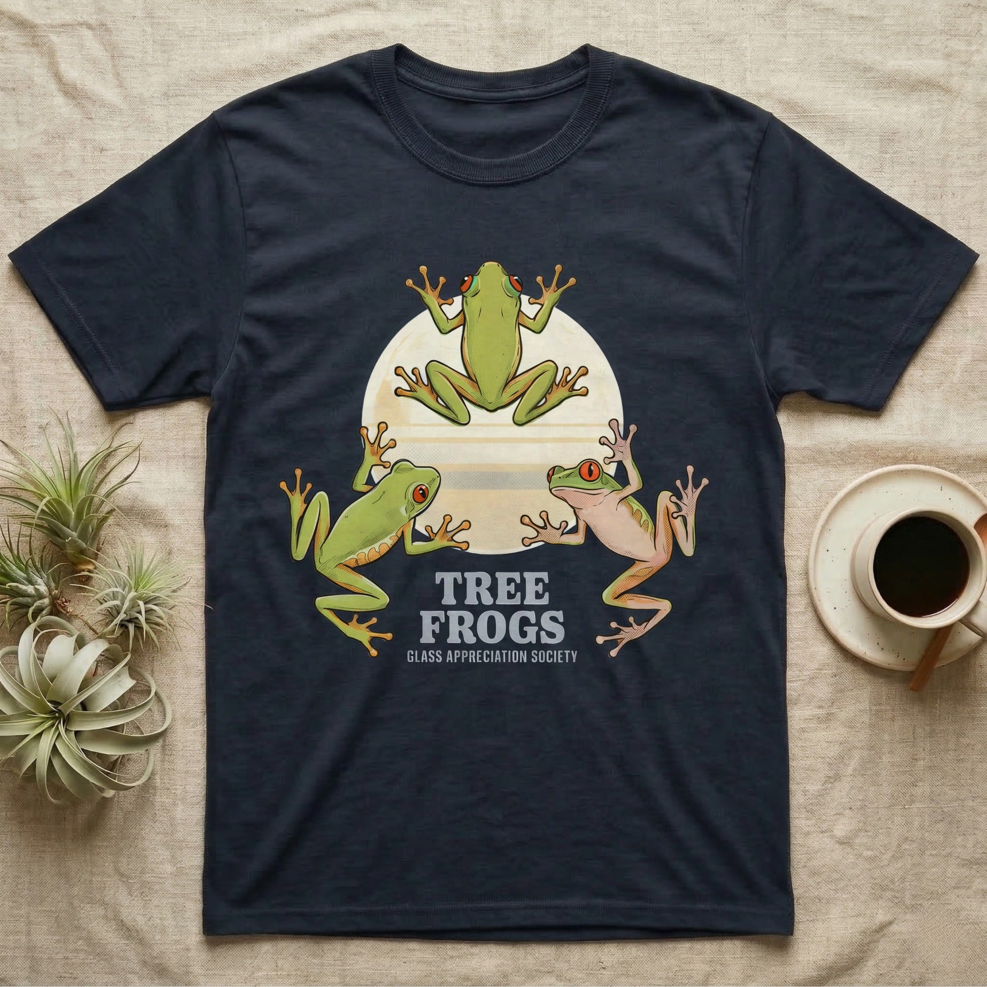 Three Tree Frog Moon T-Shirt in Navy — Retro-illustration of three tree frogs in splayed glass-cling poses around a stratified halftone full moon.