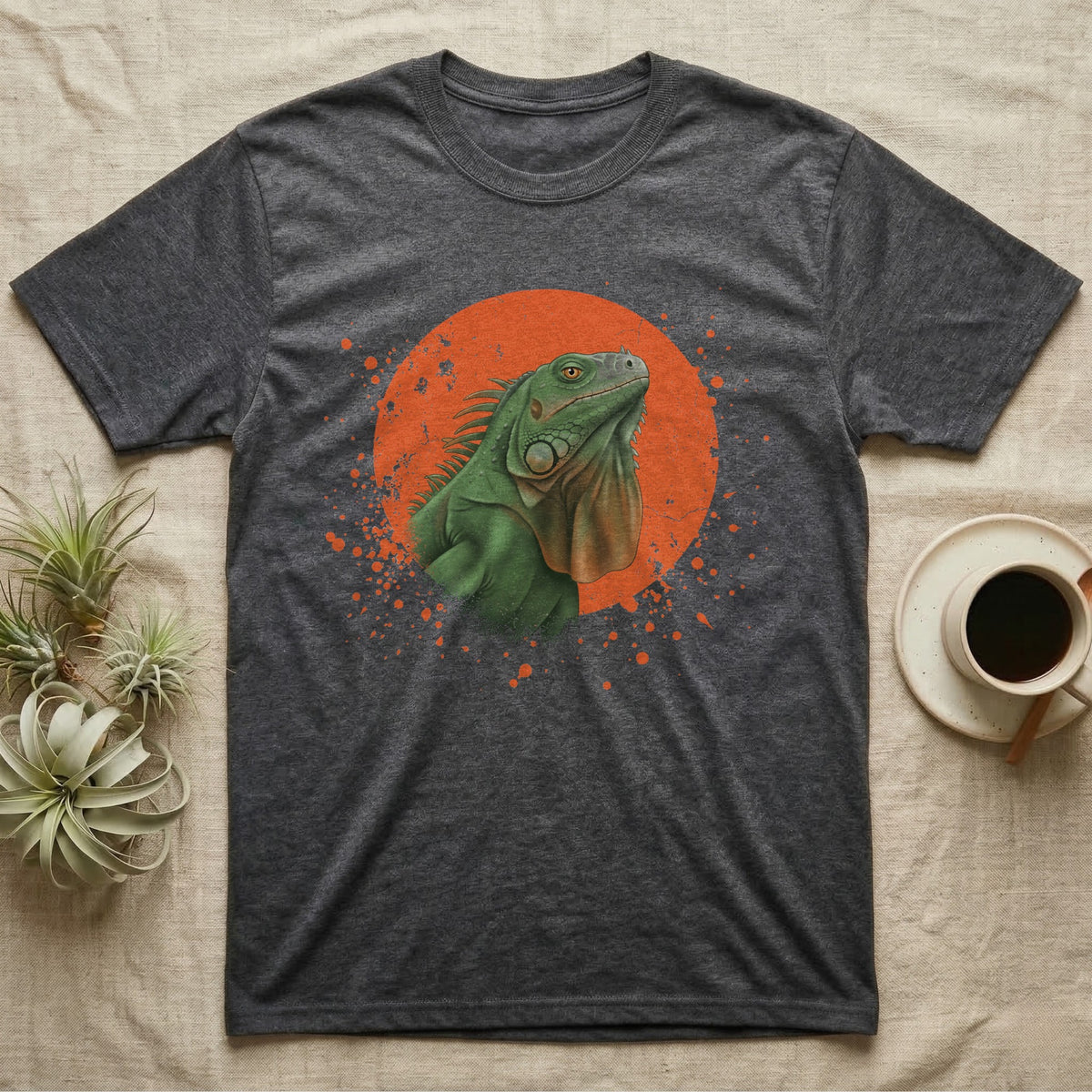 Green Iguana Stink Face T-Shirt in Dark Heather — Distressed vintage-style illustration of a green iguana with its dewlap fully dropped and chin lifted, on an orange disc.