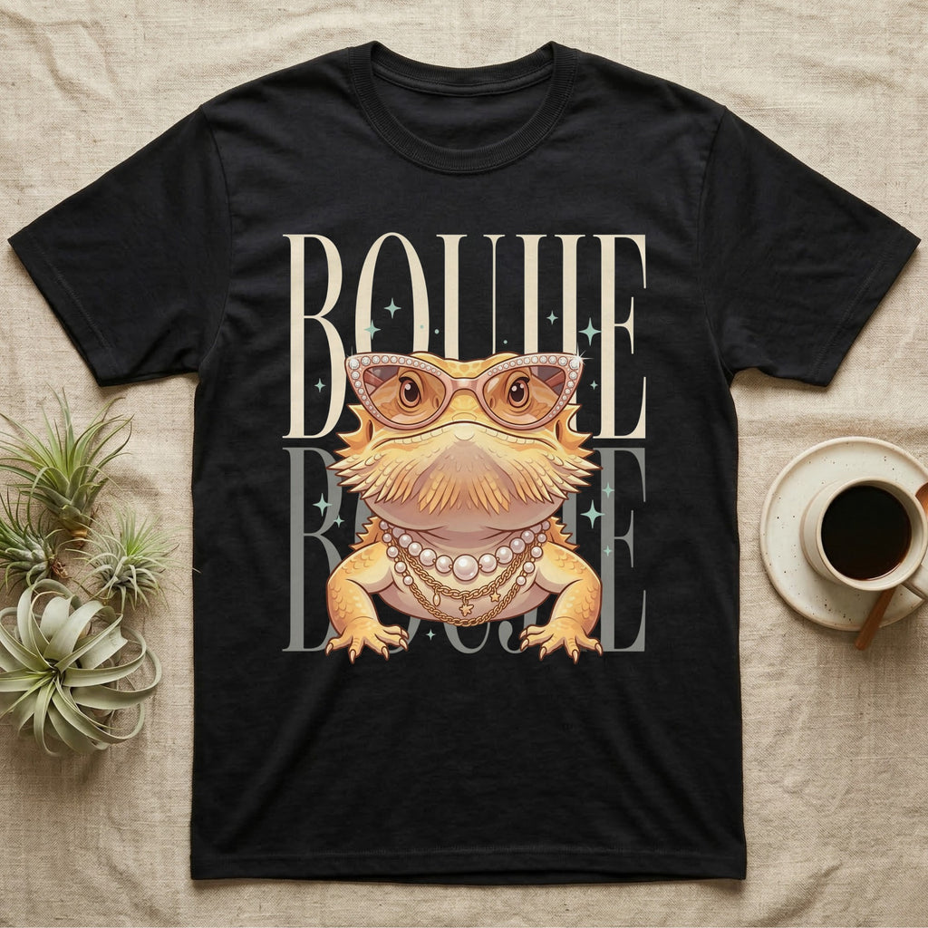 Bearded dragon wearing sunglasses and pearl necklace on black t-shirt.