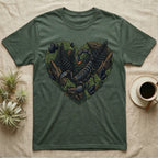 Scorpion and foliage heart illustration on a green t-shirt.