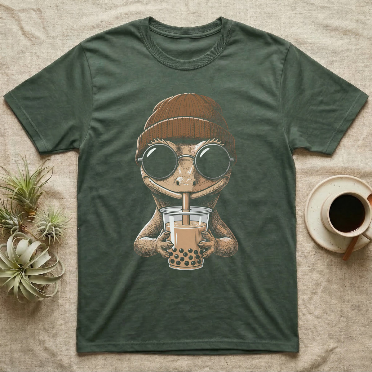 Crested Gecko Boba Tea T-Shirt in Military Green — Cross-hatch engraving of a crested gecko in a beanie and round glasses sipping boba milk tea.
