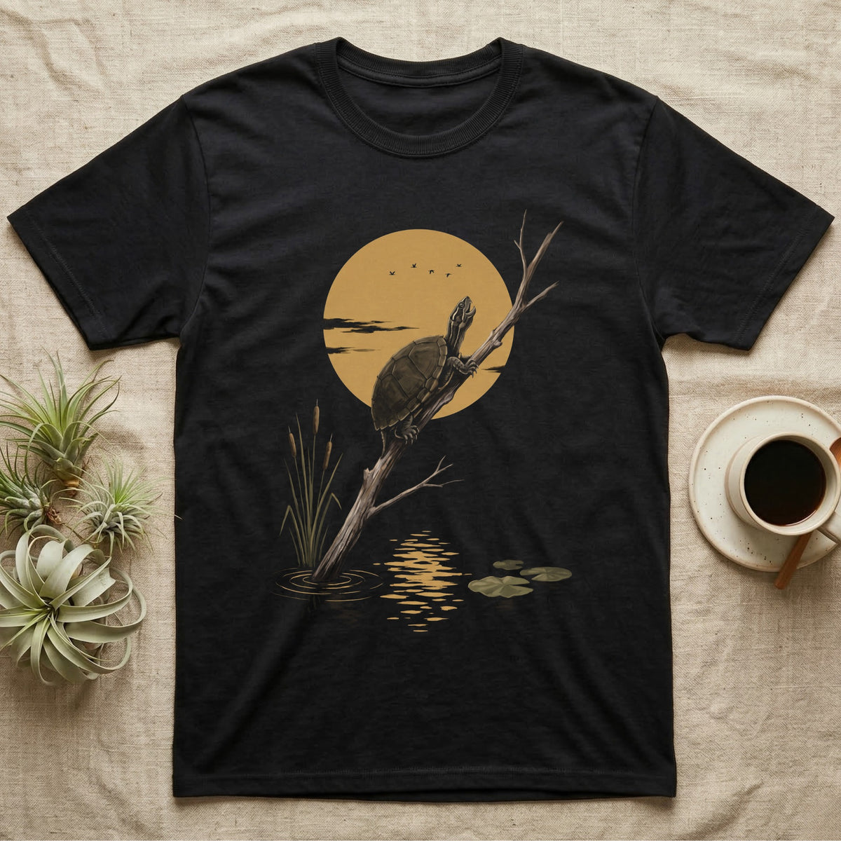 Musk Turtle Moon T-Shirt in Black — Painted 90s wildlife art of a musk turtle on a bare branch howling at a big golden moon behind it, cattails and lily pads below, on black