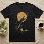 Musk Turtle Moon T-Shirt in Black — Painted 90s wildlife art of a musk turtle on a bare branch howling at a big golden moon behind it, cattails and lily pads below, on black